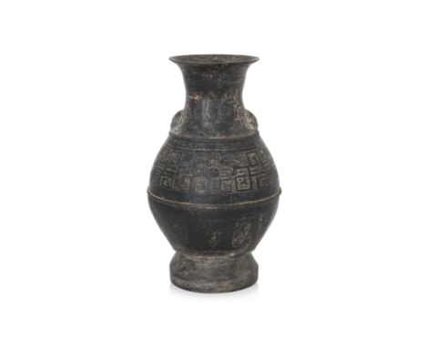 A LARGE ARCHAISTIC BRONZE 'HU' FORM VASE
Probably late Ming dynasty, baluster form vase with waisted neck, decorated in archa