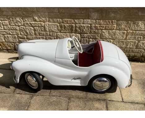 The Austin J40 pedal car is a miniature replica of the Austin A40 motor car produced by the Austin Motor Company. The J40 was