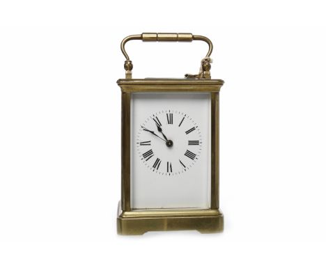 EARLY 20TH CENTURY BRASS CASED CARRIAGE CLOCKthe white enamel dial with Roman numerals, with steeled blue hands, balance whee
