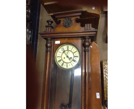 VICTORIAN VIENNA-STYLE MAHOGANY CASED WALL CLOCKthe enamel dial with Roman numeral chapter ring and subsidiary seconds dial, 