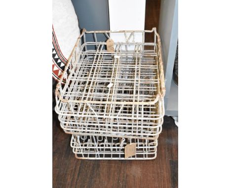 A pair of vintage milk bottle crates, L45cm x W36cm