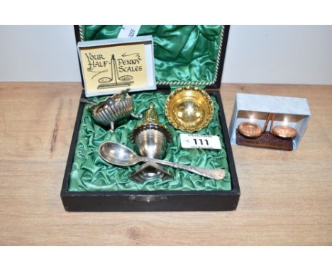 A vintage condiment set, having gilded interiors, to include salt spoons, pepperettes, a pair of mustard bowls and spoon, sol