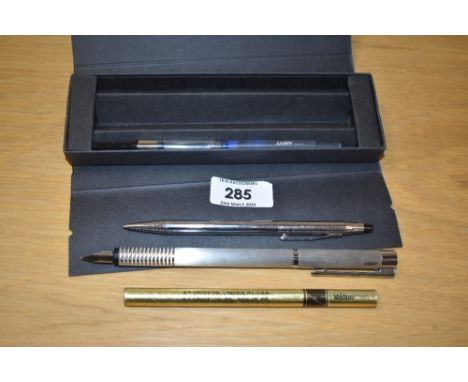 A boxed Lamy Logo converter/ cartridge fill fountain pen with a Cross ballpoint with boxed refill. Both engraved