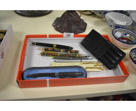 A selection of decorative ballpoint and fountain pens including Papermate cartridge fill fountain pen and leather three pen w