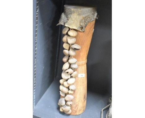 A vintage&nbsp;Papua New Guinea&nbsp;wooden drum musical instrument having snakeskin top and decorated with seeds, h59cm