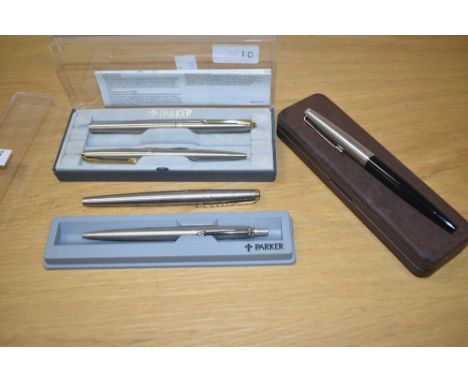 A collection of Parker fountain and ballpoint pens including a 45 Flighter set, a boxed 45 in black with lustraloy cap
