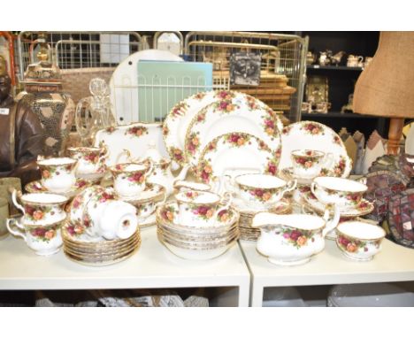A Royal Albert Old Country Rose pattern tea service having lobbed form with gilt edging, to include ashet, soup bowls, cups a