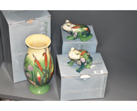 A pair of Country Artist ceramic frog studies decorated in the Moorcroft style having pink, red and blue foliage on a glaze g