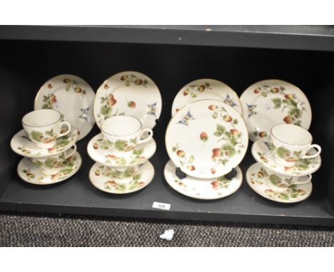 A Crown Staffordshire fine bone china part tea service, decorated with strawberries and butterfly's on an ice white ground, t