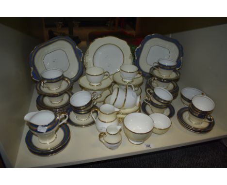 A part Wedgwood tea service having gilt edges on a cream and white ground, makers mark to base, pattern w4169, (23), sold tog