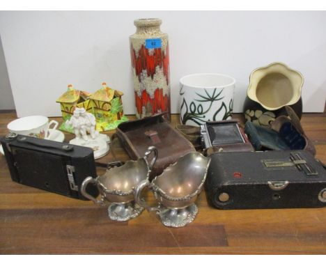 A mixed lot comprising Poole pottery, cameras to include Kodak, crested china, an ashtray and other items 