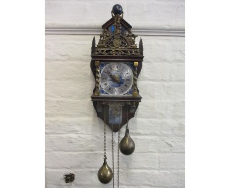A Dutch reproduction mahogany and brass cased wall clock with blue and white tiles 