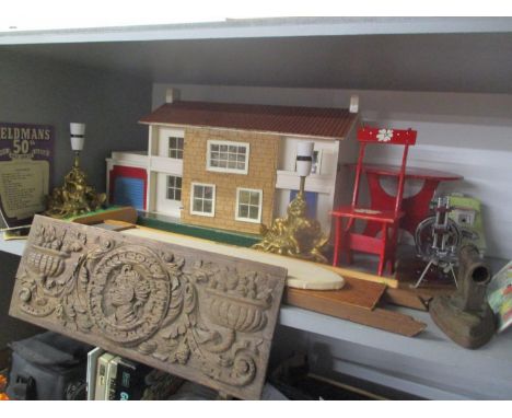 A mixed lot to include a dolls house with furniture, miniature sewing machine, carved oak panel, table lamps and other items 