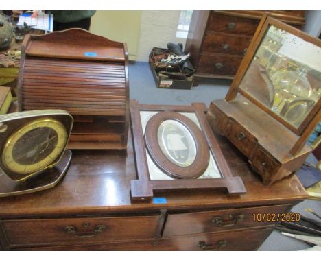 A modern hardwood letter rack with tambour front, together with an inlaid mahogany and mirrored photo frame, a vintage mantle