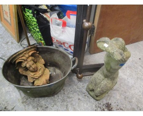 A mixed lot to include a small garden statue of a kneeling female, a fire surround, wall bracket and other items 