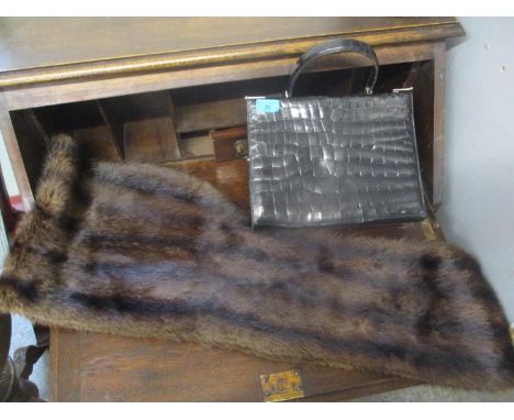 A mink fur wrap together with a vintage black crocodile skin handbag 