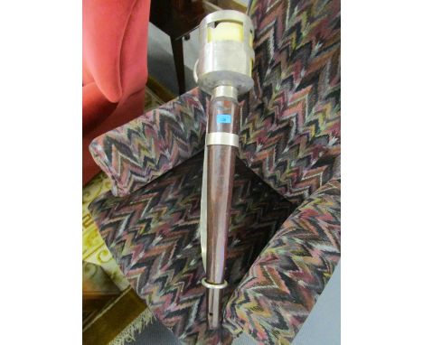 A large rustic wooden and metal wall mounted candlestick 