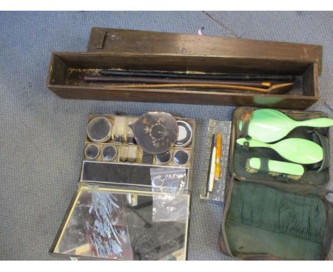 Two vintage vanity and brush sets, mixed pens, a glass pen holder, and a treen box with contents 