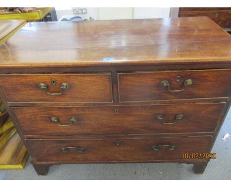 A George III mahogany chest of two short and two long drawers, on bracket feet 