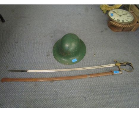 A WWII German Officers sword and scabbard, the fullered blade marked Soligen Alcos, 33 6/8" long, brass guard and black handl