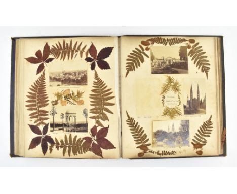 A mid 19th century Victorian 1860s - 1870s scrap book / photograph album. The album containing pressed flowers and leaves, en