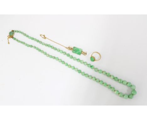 15ct gold carved jade and seed pearl brooch, 9ct gold jade cabochon ring and a strand of jade beads with yellow metal clasp f