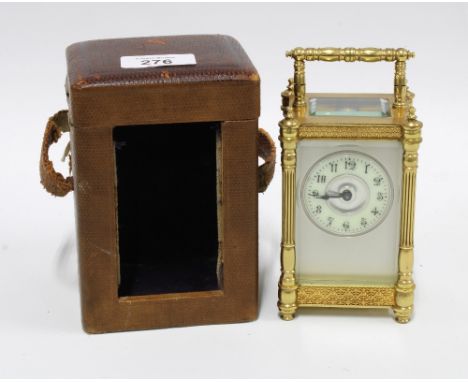 Brass and glass cased carriage clock, 14cm, in leather carry case 