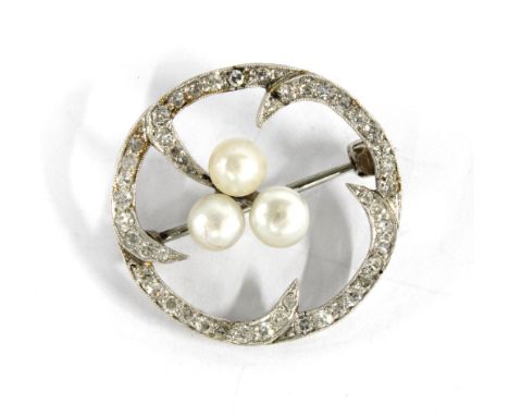 Diamond and pearl brooch set in a circular  white metal open frame, unmarked, with a Hamilton &amp; Inches box, 2.3cm diamete