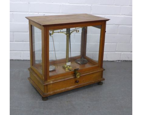 Mahogany cased set of balance scales, 42 x 42 x 24cm. 