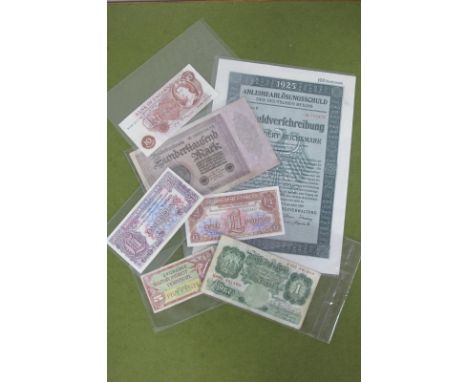 A 1925 One Hundred Reichsmark Germany Bond; together with a pair of British Armed Forces £1 Notes, Germany 100,000 Mark 1923 