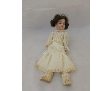 A German bisque headed doll with sleeping eyes, open mouth with teeth and composition body, impressed mark 50 3/0 Germany, 15