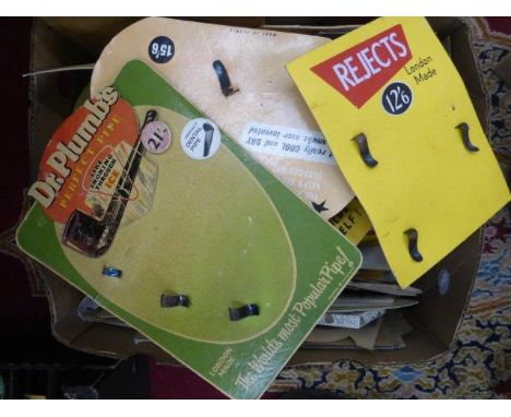 A box of tobacco and pipe related showcards and advertising. 