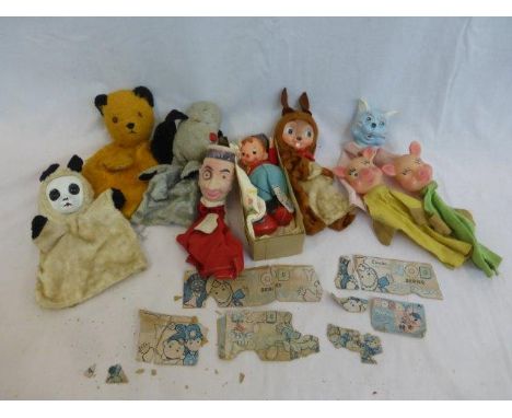 A collection of assorted hand puppets including Sooty and Sweep, a Linda Noddy puppet etc. 