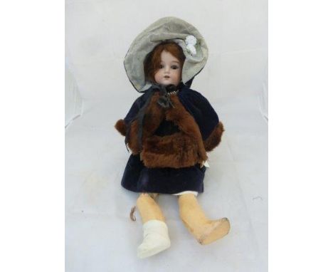 An Armand Marseille bisque headed doll with sleeping eyes, an open mouth with teeth, with composition, jointed limbs and impr