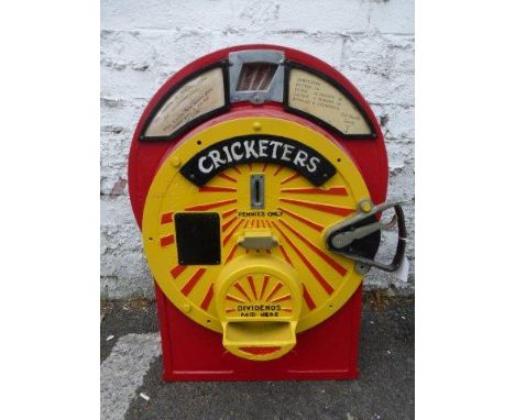 A cast iron 'Littlestockbroker' machine, circa 1928, converted to 'Cricketers' in 1953 on an old penny, bearing cricketer's n