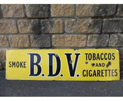 A B.D.V Tobaccos and Cigarettes enamel advertising sign, 51 x 14".