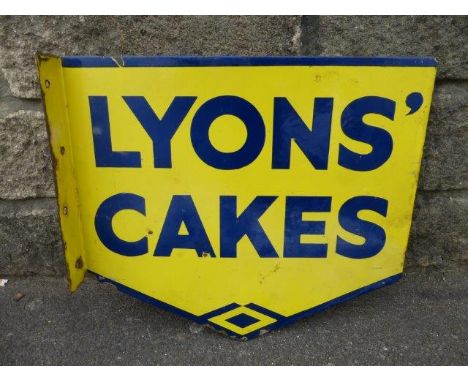 A Lyons' Cakes shaped double sided enamel sign with hanging flange, 17 1/2 x 15 1/2".