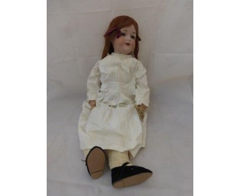 An Armand Marseille bisque headed doll with sleeping eyes, an open mouth with teeth and composition jointed limbs, impressed 