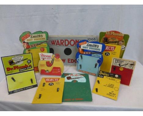 A box of tobacco and pipe related showcards and advertising. 