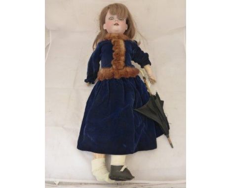 An Armand Marseille bisque headed doll with sleepy eyes and an open mouth with four teeth, with composition body and articula