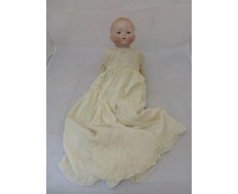 An Armand Marseille bisque headed doll with sleepy eyes, a closed mouth, composition hands and a cloth body, stamped AM Germa