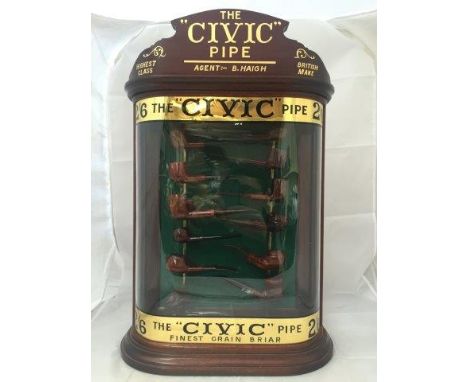 A decorative mahogany glass bow fronted display cabinet advertising 'The Civic Pipe', containing a display of pipes, 25 x 16 