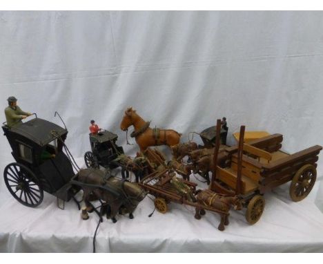 A collection of wooden scale models. mostly of horse drawn carts etc. 