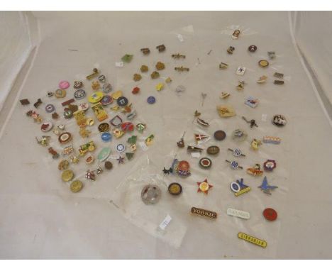 A comprehensive collection of badges including an early Felix, an enamel Norfolk pennant, early Butlins, early Girl Guides, s