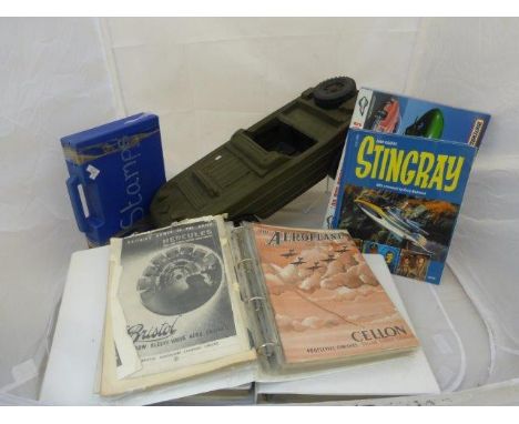 An assortment of loose stamps, three folders of Aeroplane magazines, an Action Man amphibius vehicle and a Matchbox Thunderbi