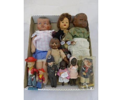 An assortment of mostly 1930s-1950s dolls including an early Effanbee USA doll. 