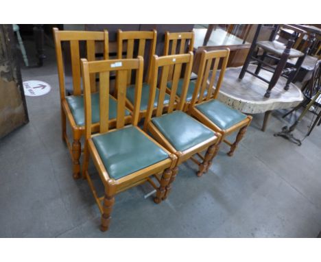 A set of six light oak dining chairs 
