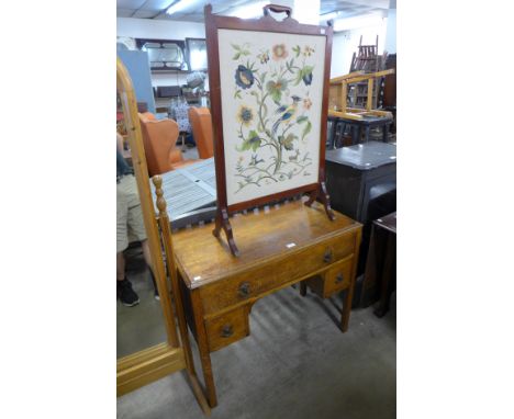 An oak side table and a fire screen 