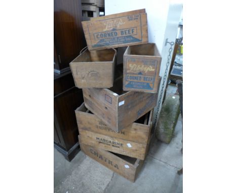 Assorted vintage wooden advertising crates 