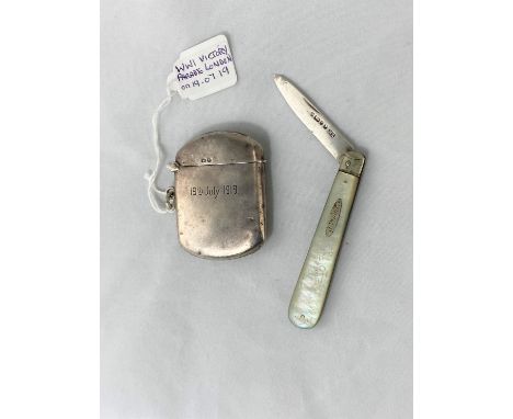 A hallmarked silver vesta case commemorating the WW1 victory parade in London 19.7.19 and a hallmarked silver bladed pearl ha